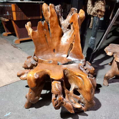 Teak root chair with fish carvings