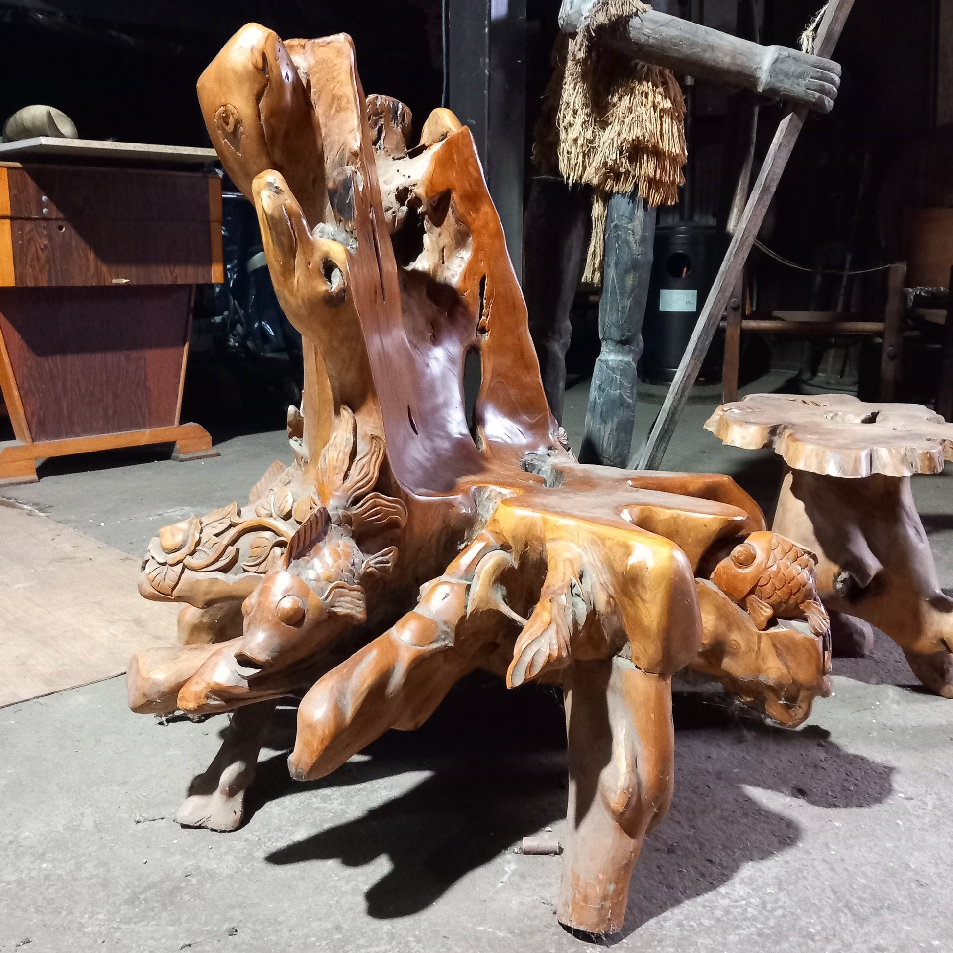 Teak root chair with fish carvings