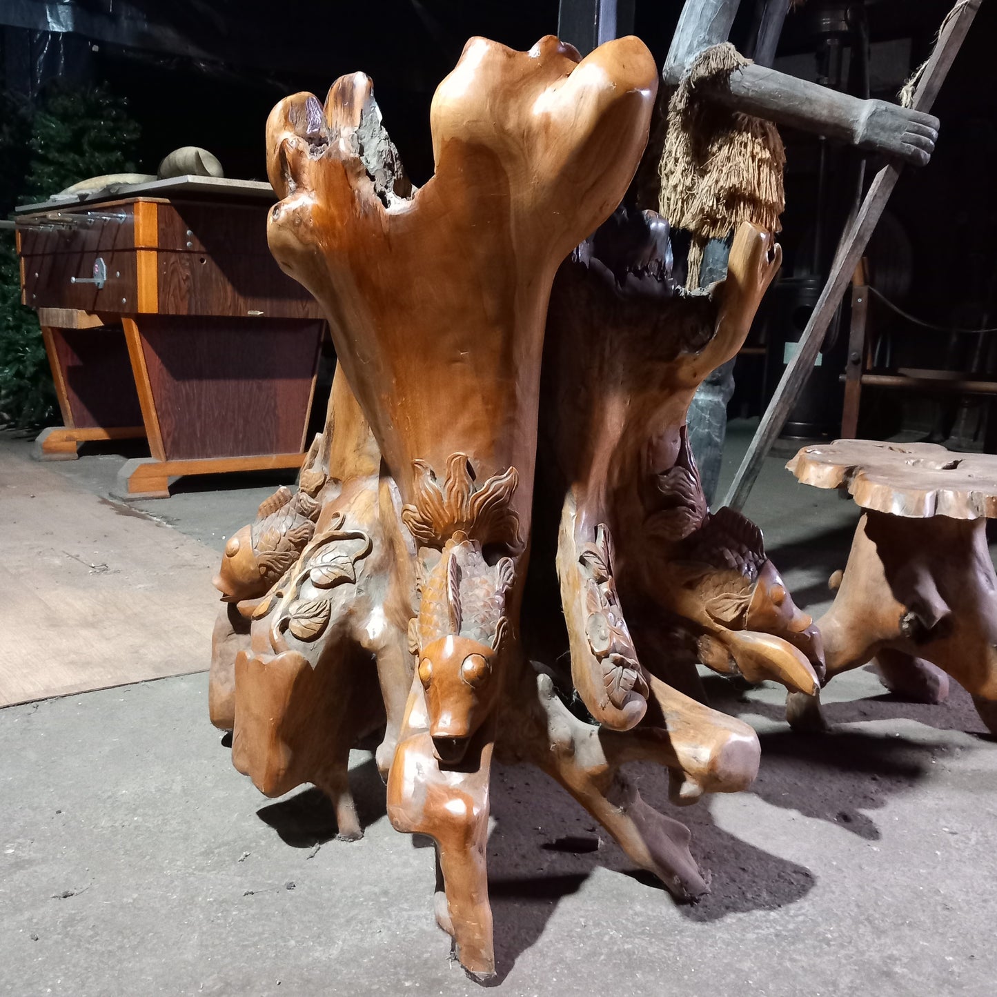 Teak root chair with fish carvings